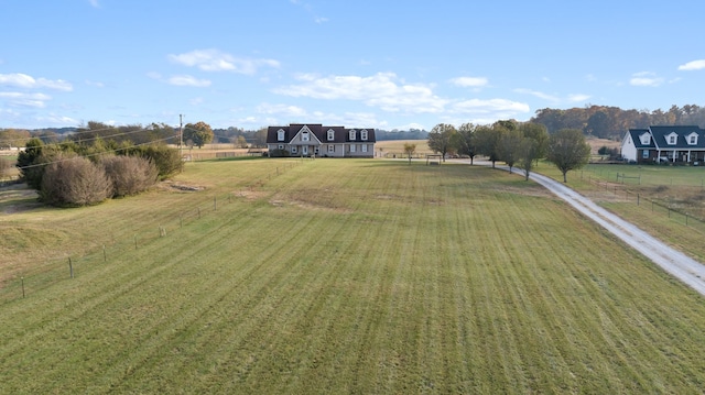 view of yard with a rural view