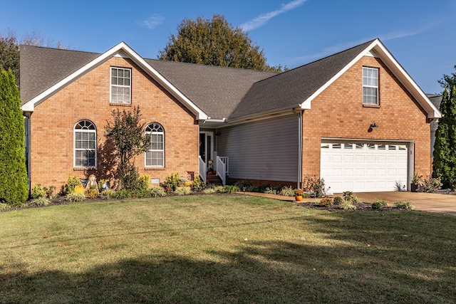 front facade with a front yard and a garage