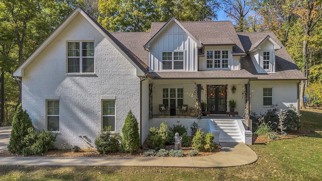 view of front of home with a front lawn and a porch