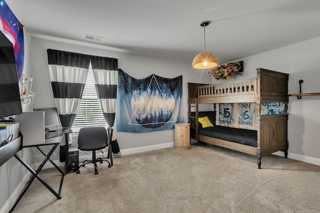 carpeted bedroom with ornamental molding