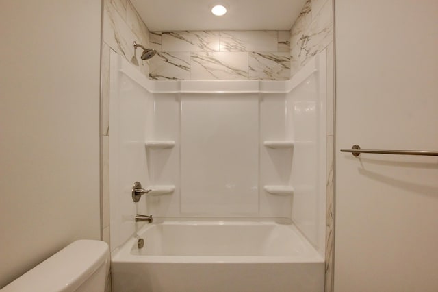 bathroom featuring  shower combination and toilet