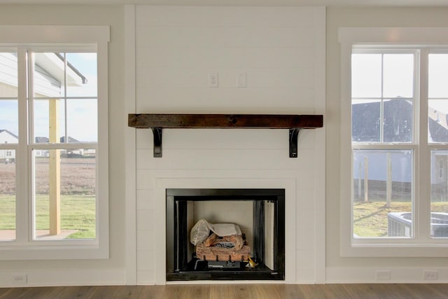 interior details with central AC unit and wood-type flooring