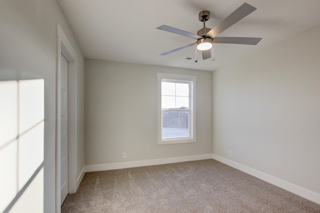 carpeted empty room with ceiling fan