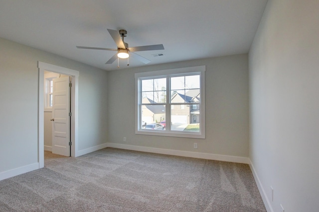 carpeted empty room with ceiling fan