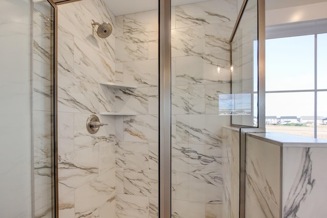 bathroom featuring a tile shower