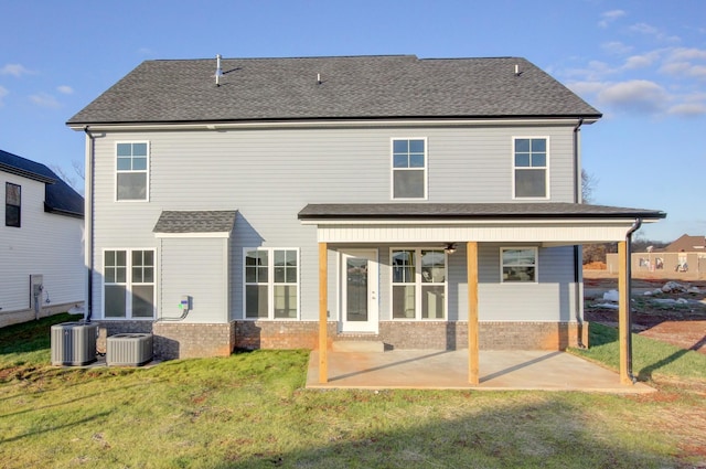 back of house with a lawn, a patio area, ceiling fan, and cooling unit