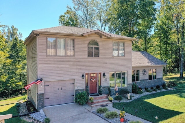 view of front facade featuring a front yard and a garage