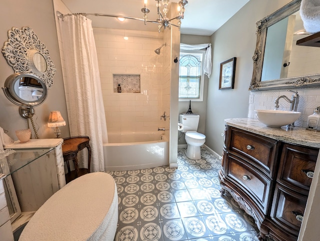 full bathroom featuring vanity, toilet, shower / bathtub combination with curtain, and an inviting chandelier