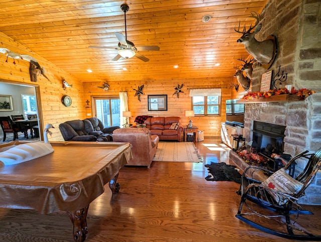 living room with ceiling fan, wood-type flooring, wooden ceiling, a fireplace, and pool table