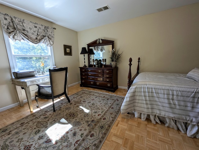 bedroom featuring light parquet flooring