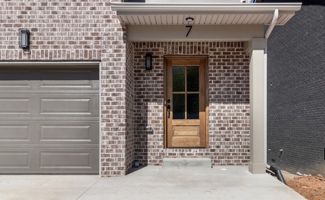 doorway to property featuring a garage