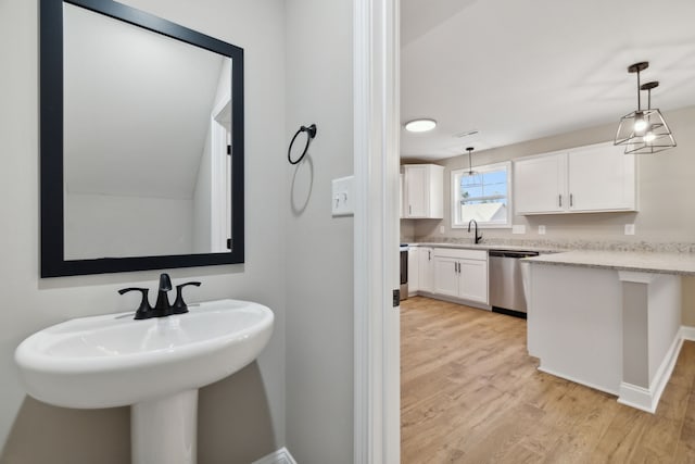 bathroom featuring sink and wood-type flooring