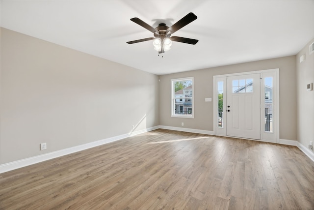 entryway with light hardwood / wood-style floors and ceiling fan