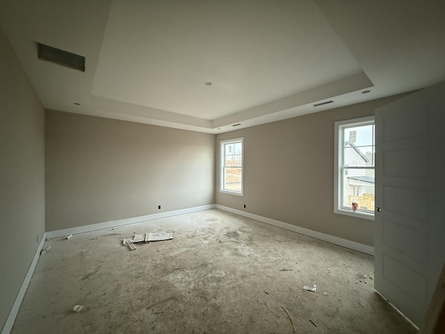 empty room with a raised ceiling