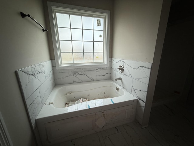 bathroom featuring a tub