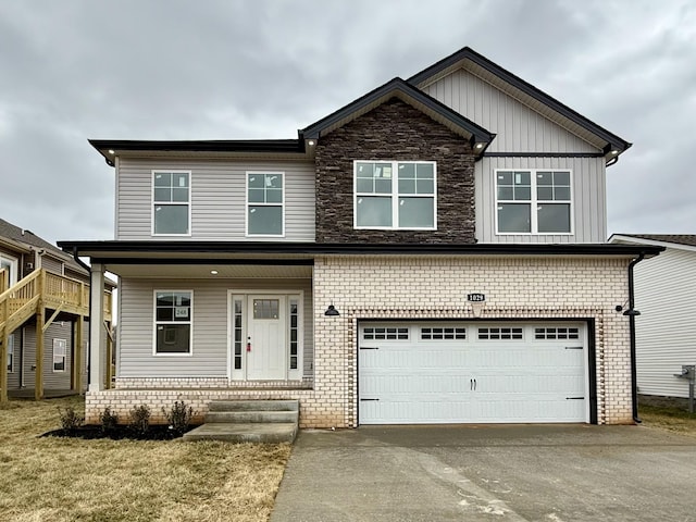 view of front of property with a garage and a front lawn