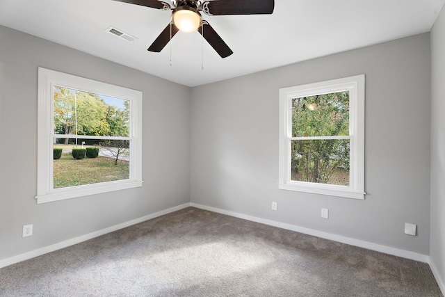 carpeted empty room featuring ceiling fan