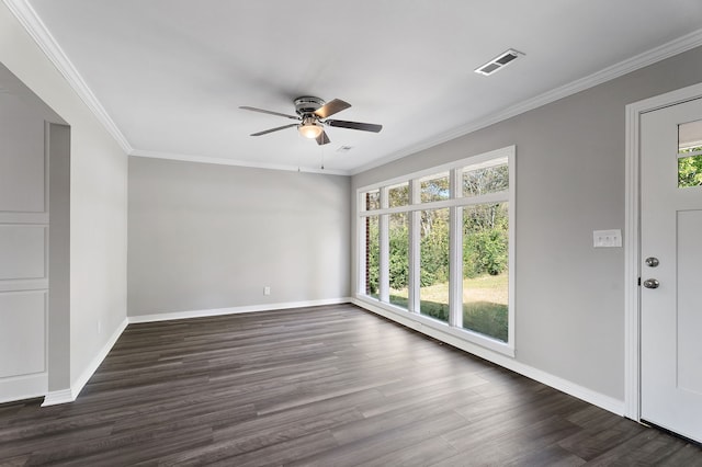 empty room featuring ornamental molding, ceiling fan, and dark hardwood / wood-style flooring