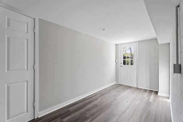 spare room with dark hardwood / wood-style flooring