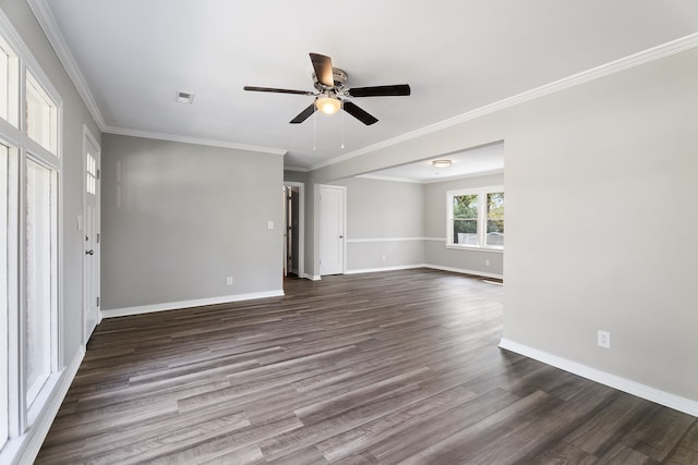 empty room with crown molding, dark wood-type flooring, and ceiling fan