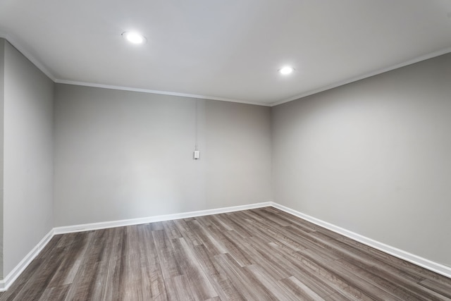 unfurnished room featuring crown molding and hardwood / wood-style flooring