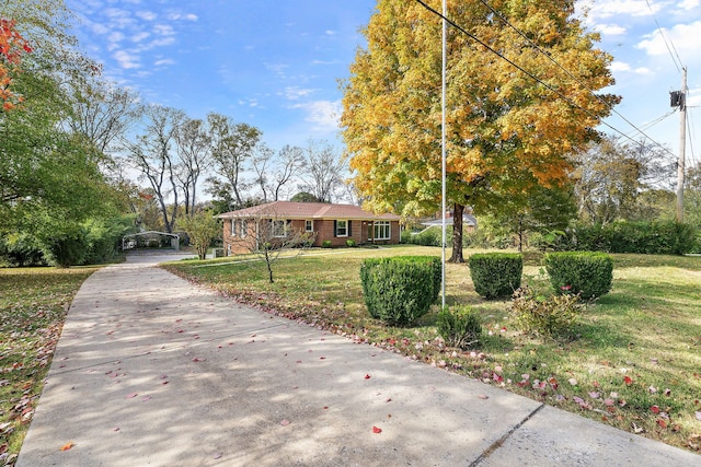 single story home featuring a front yard