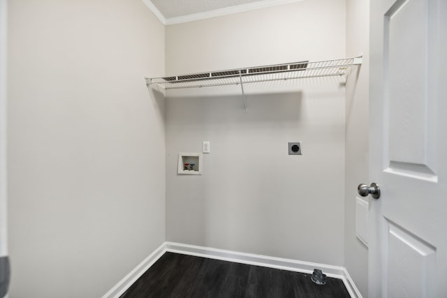 clothes washing area featuring ornamental molding, dark hardwood / wood-style flooring, washer hookup, and hookup for an electric dryer