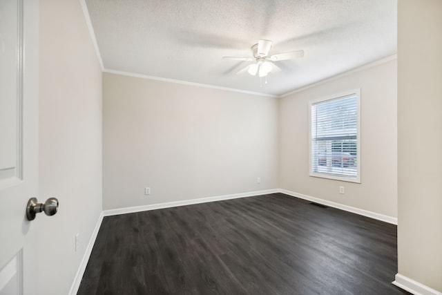 empty room featuring ornamental molding, ceiling fan, dark wood-type flooring, and a textured ceiling