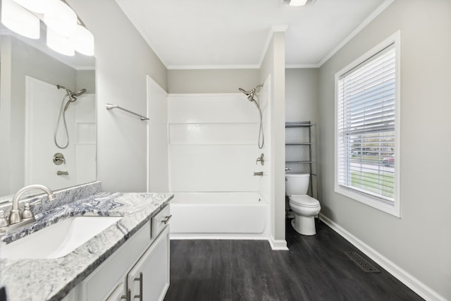 full bathroom featuring vanity, hardwood / wood-style flooring, plenty of natural light, and ornamental molding