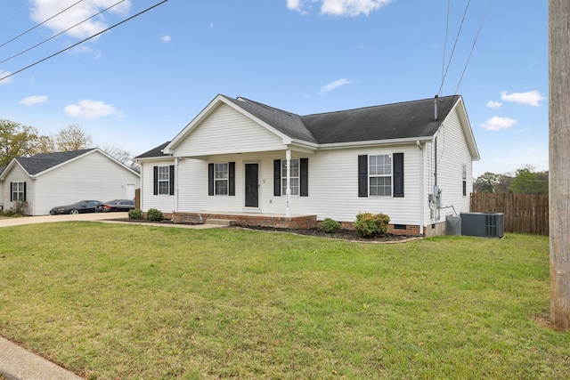 ranch-style house with a porch, cooling unit, and a front yard