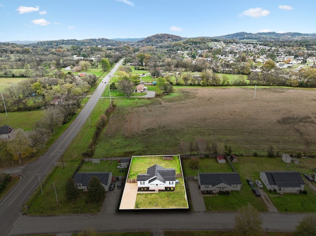 birds eye view of property with a mountain view