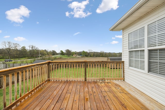 wooden deck with a lawn