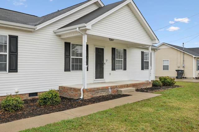 view of front of house featuring a front yard and covered porch