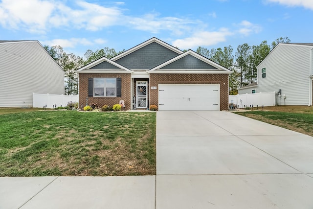 craftsman house featuring a front yard and a garage