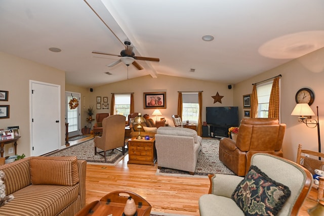 living room with vaulted ceiling with beams, light wood-type flooring, and ceiling fan