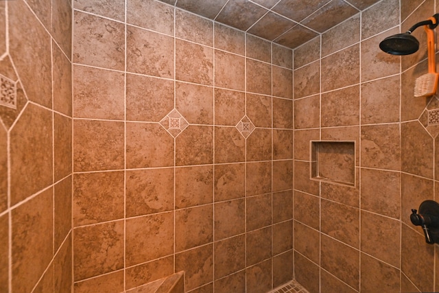 bathroom with a tile shower