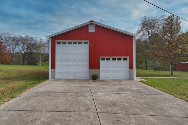 garage featuring a yard