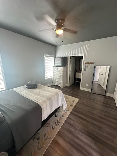 bedroom with dark wood-type flooring and ceiling fan