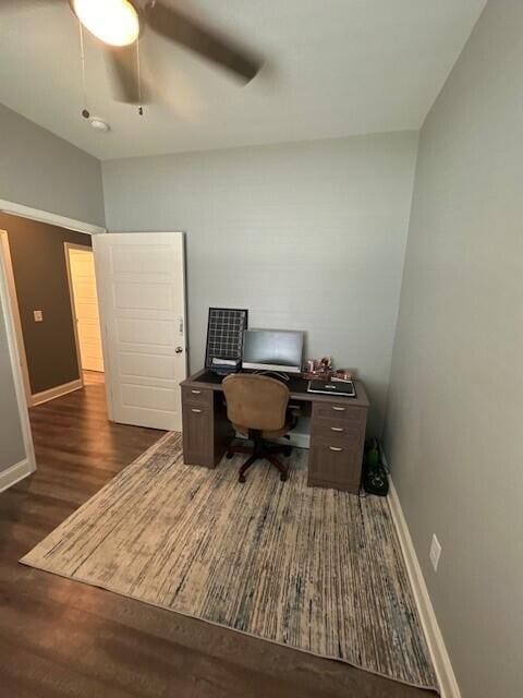 office space featuring ceiling fan and dark hardwood / wood-style floors