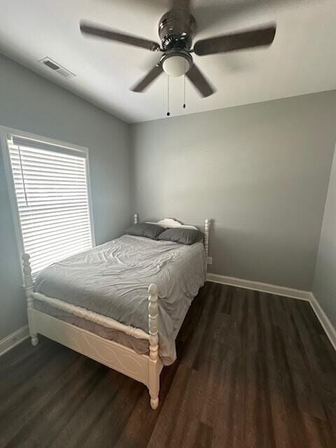 bedroom featuring dark hardwood / wood-style floors and ceiling fan