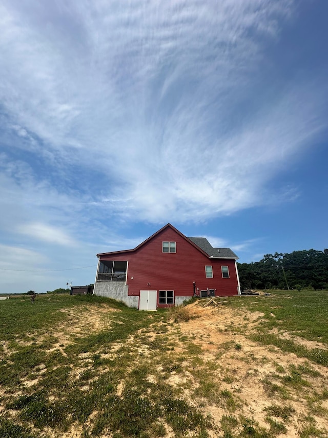 view of side of property featuring a rural view