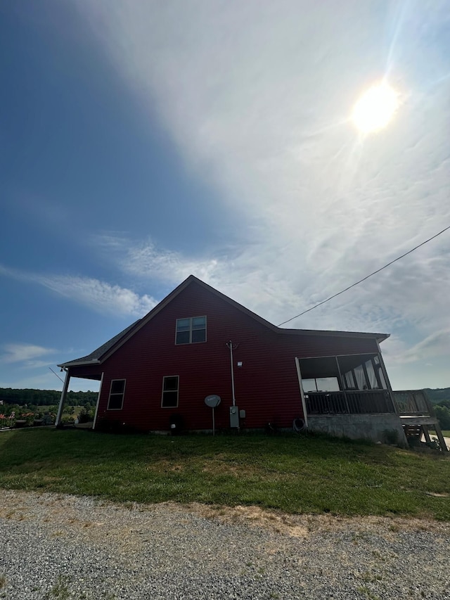 view of home's exterior with a yard