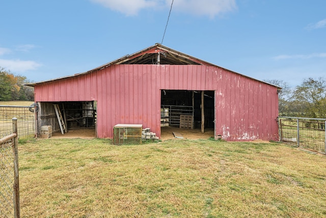 view of outbuilding with a yard