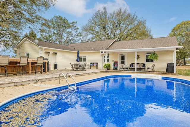 view of pool featuring a patio area