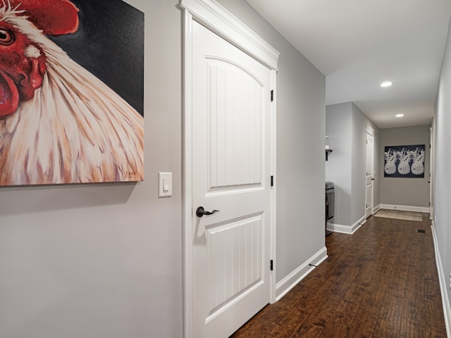 corridor with dark hardwood / wood-style floors