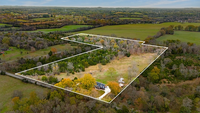 birds eye view of property with a rural view