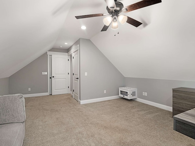 bonus room featuring light carpet, ceiling fan, and lofted ceiling