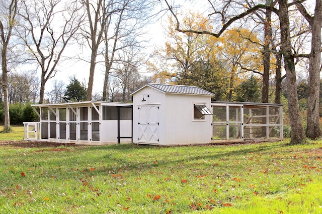 view of outbuilding with a lawn