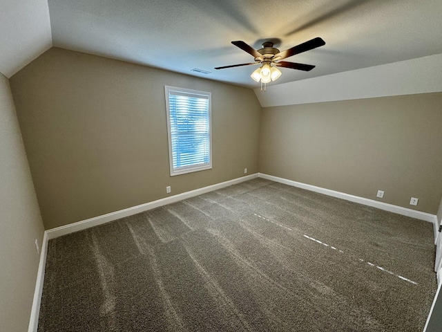 additional living space with lofted ceiling, ceiling fan, and carpet