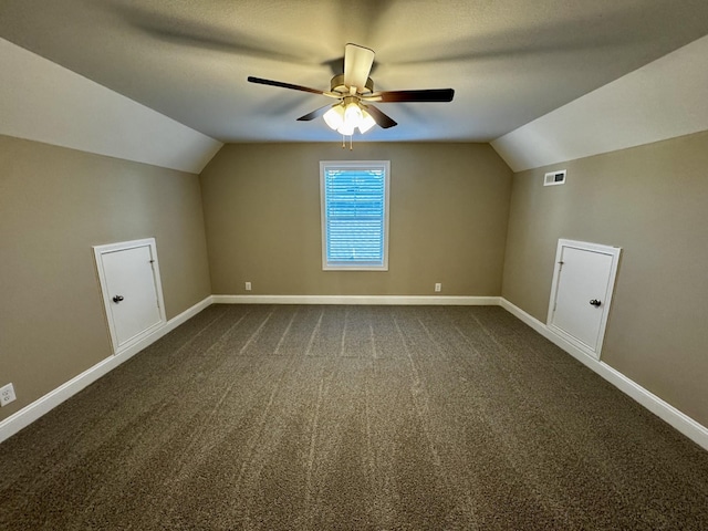 additional living space with lofted ceiling, ceiling fan, and carpet flooring